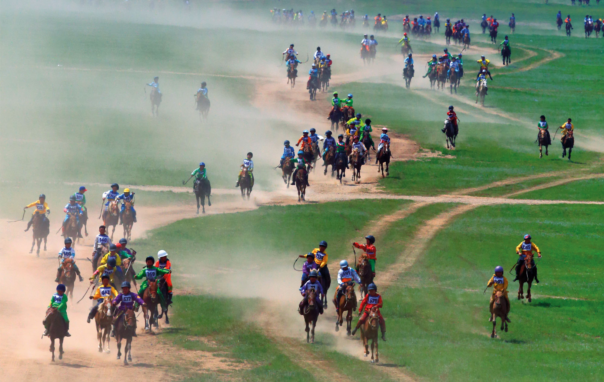 riders racing in mongolia horse riding holiday by globetrotting