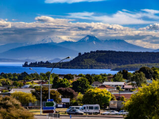 A Day Spent in Taupo, New Zealand - Taupo lake and town - Globetrotting horse riding holidays. Image by WitR via Shutterstock.